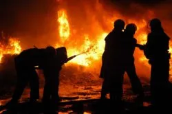 Firefighter fighting house fire regarding the ban on consumer fireworks