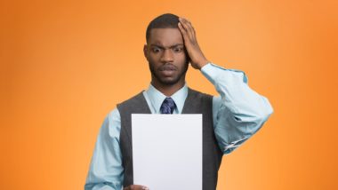 Man reading a London Life Disability Insurance Claim Denial letter