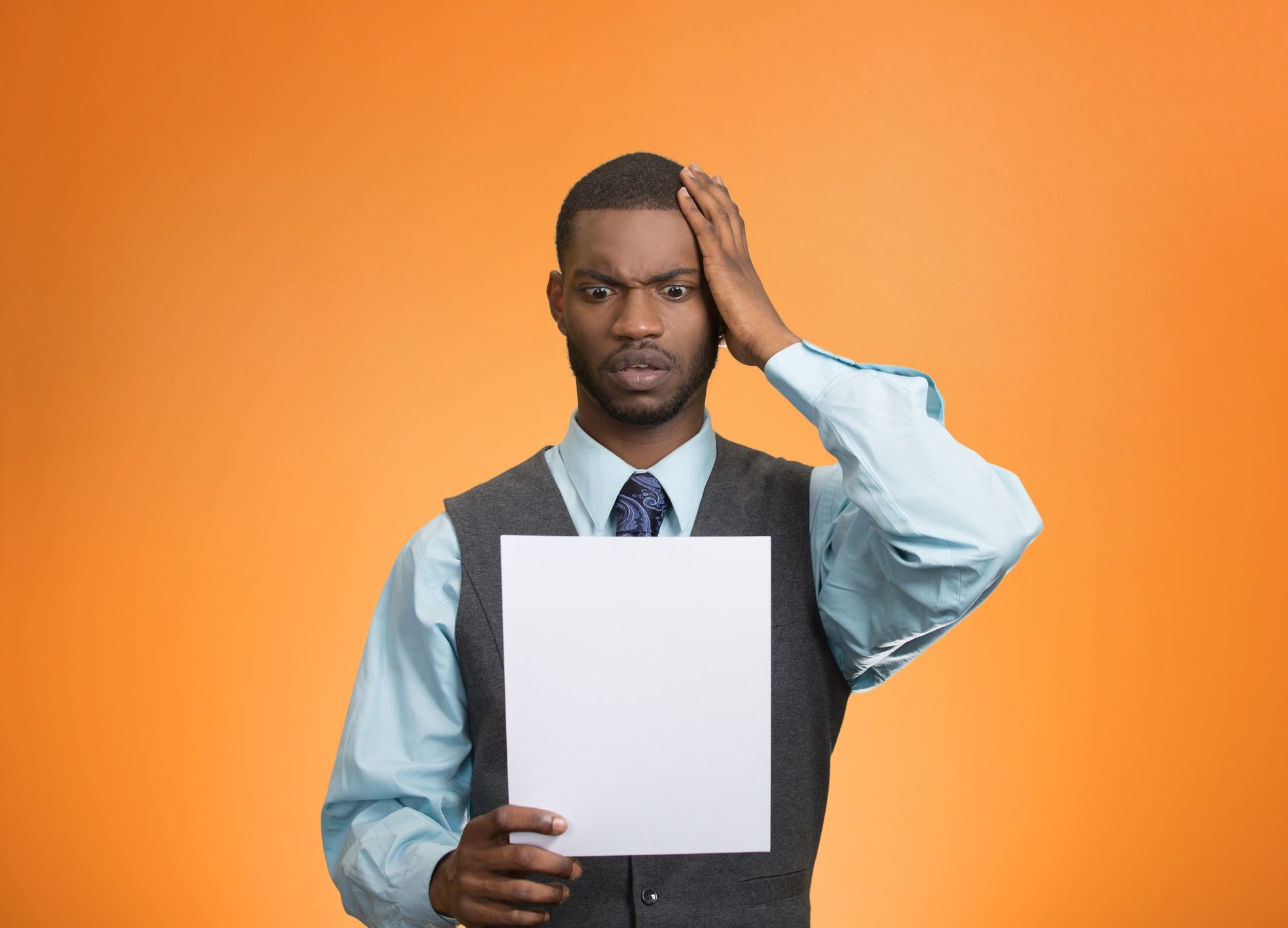 Man reading a London Life Disability Insurance Claim Denial letter