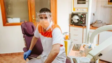 Dentist sitting with masks on regarding the Aviva Insurance breach of contract class action lawsuit filed