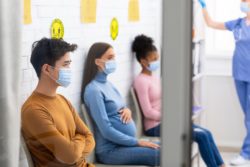 People wearing masks in hospital regarding the additional COVID-19 restrictions in Quebec