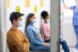 People wearing masks in hospital regarding the additional COVID-19 restrictions in Quebec