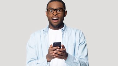 displeased man with cellphone regarding the Telus illegal cancelaltion fees class action lawsuit