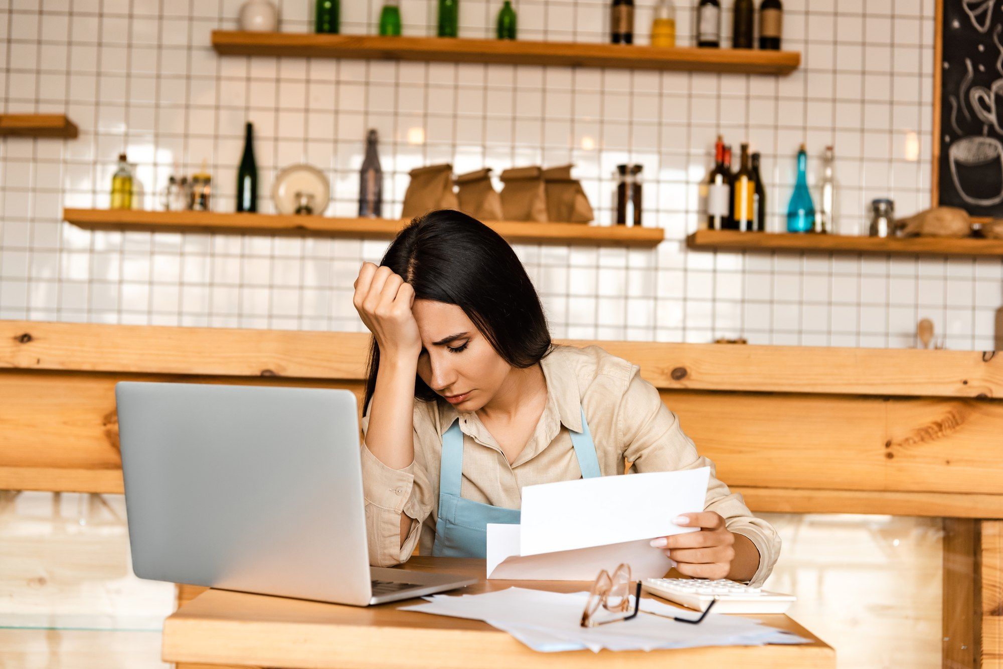 Stressed business owner reading denial letter from Novex Insurance Company
