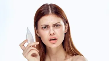 Woman holding recalled eye drops regarding the products recalled in Canada