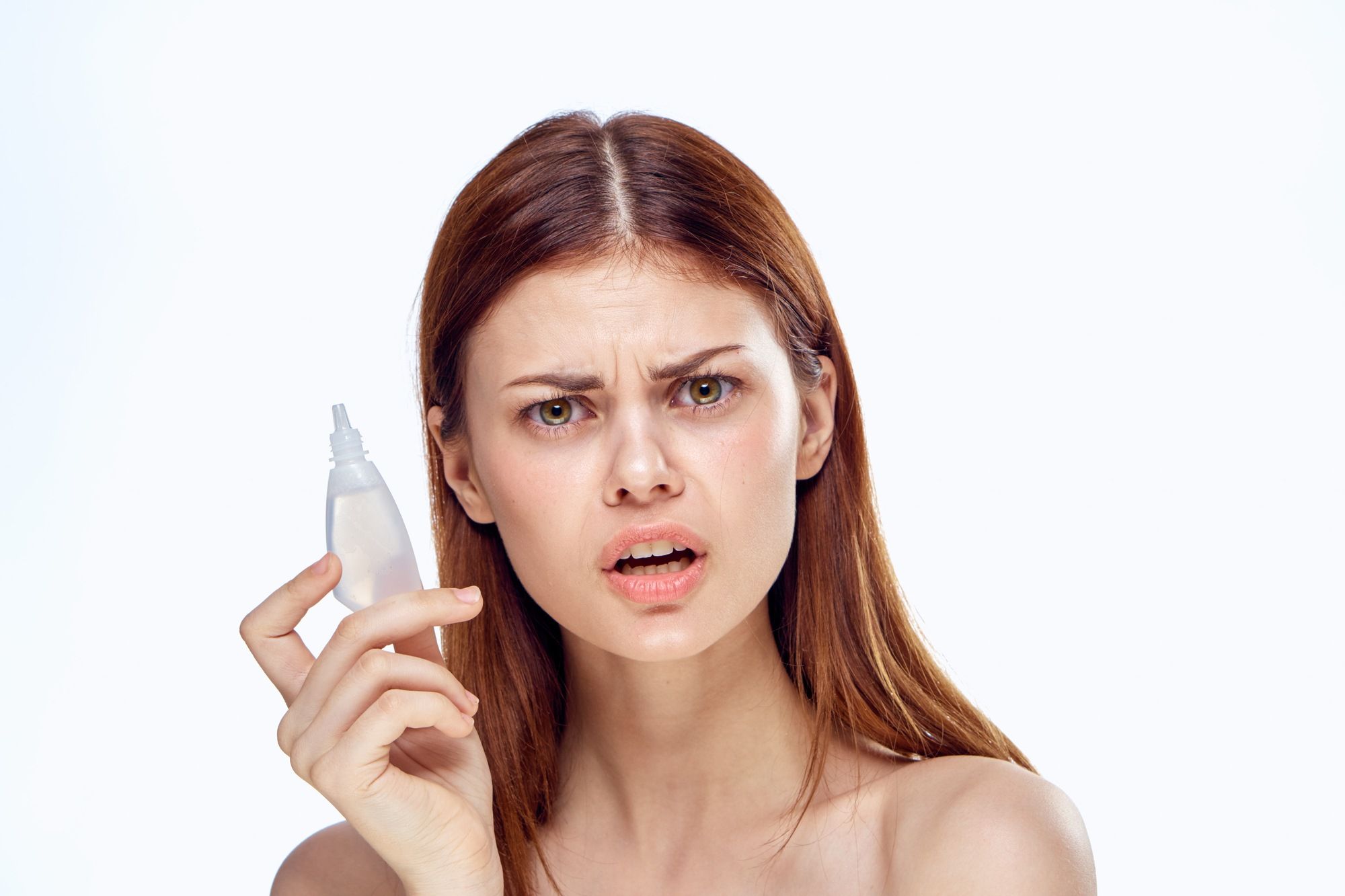 Woman holding recalled eye drops regarding the products recalled in Canada