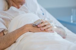 elderly man in hospital bed
