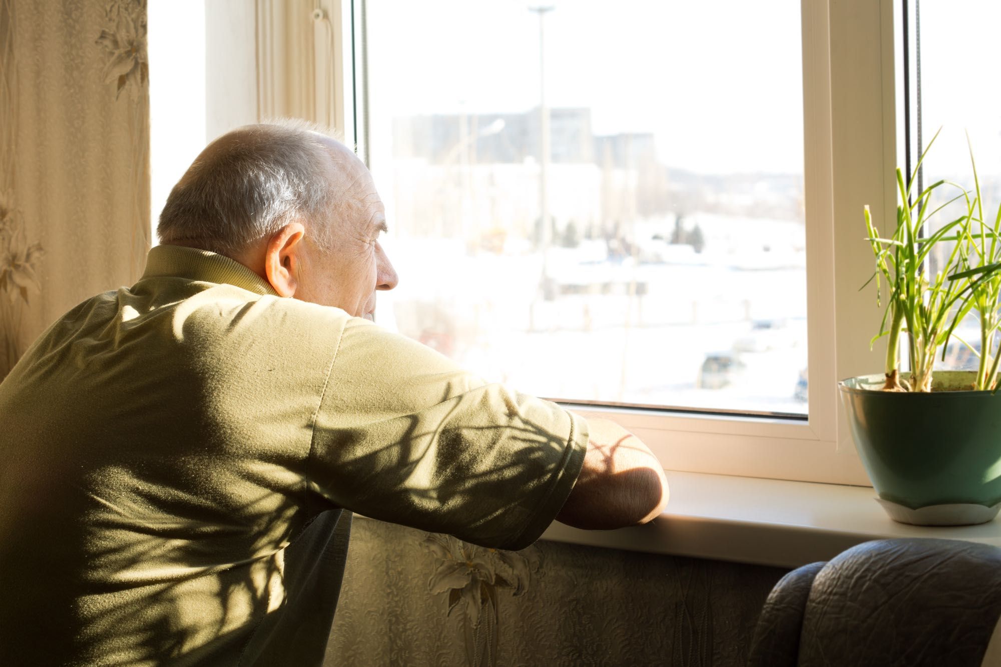 long-term care resident looking out window