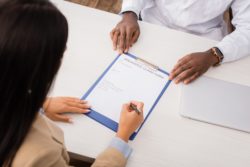 Person reviewing insurance form regarding informtion on filing a SSQ long-term disability insurance lawsuit 