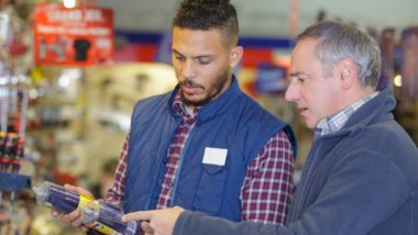 Men comparing paint thinners or varsol regarding the Recochem class action lawsuit
