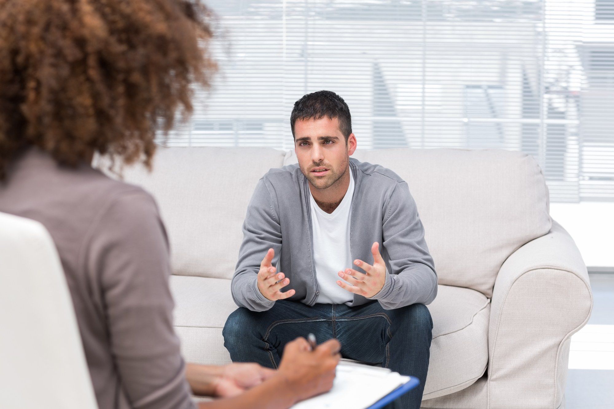 Therapist with patient regarding the mental illness class action lawsuit moving forward