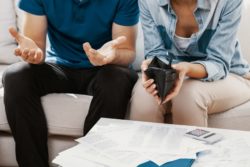 Couple stressed with no money regarding bank overdraft fees falling on customers 