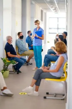 People waiting room regarding COVID-19 vaccine