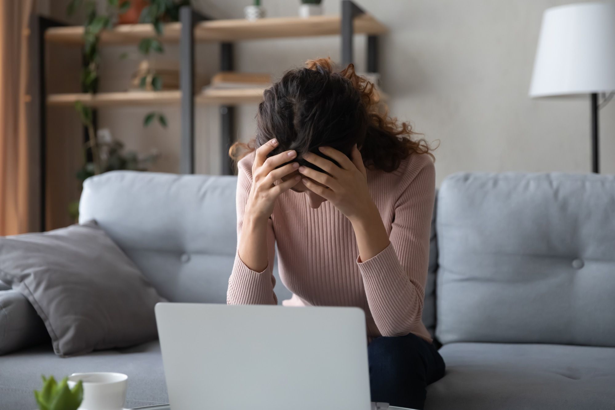 Ashamed woman regarding the MindGeek class action lawsuit 