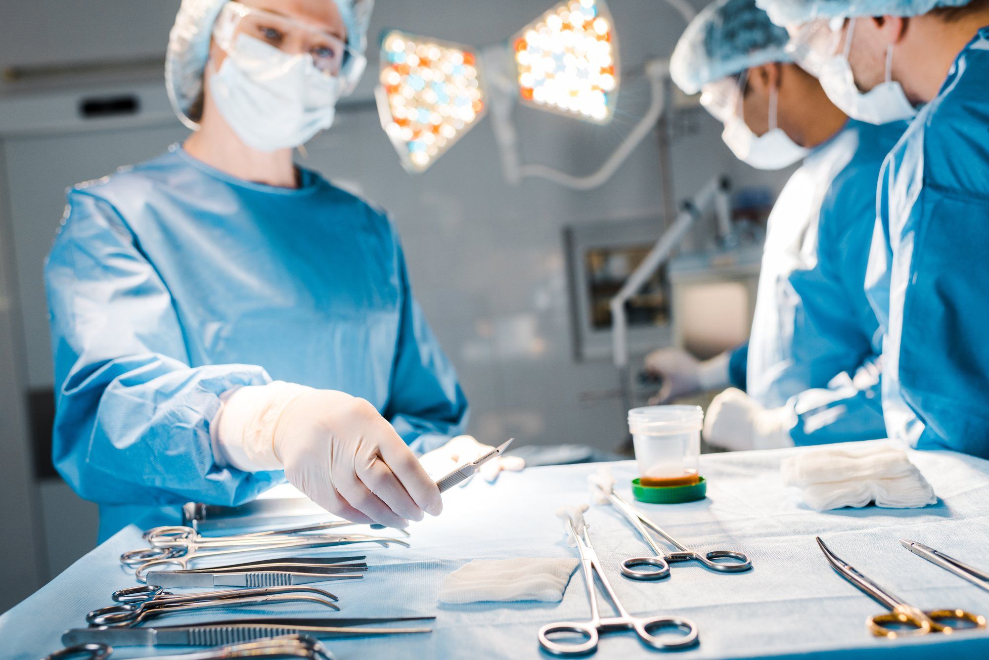 Nurse reaching for medical equipment regarding the ParaMed class action lawsuit 
