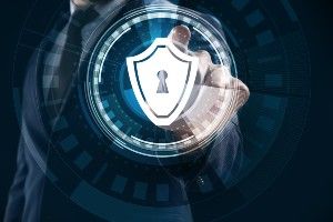 Businessman pushing button on virtual screen against dark background - dell data breach - ncix