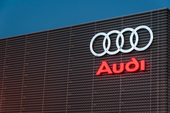 Audi logo sign on showroom premises. Audi faces class action over airbags.