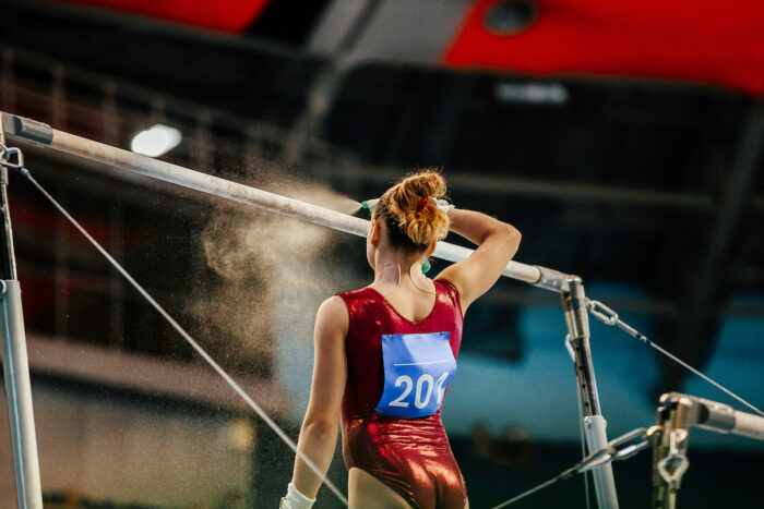 Photo of a female gymnast athlete competition at a competition.