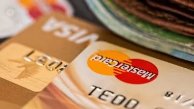 Close up of Mastercard credit card, with Visa credit card in foreground.