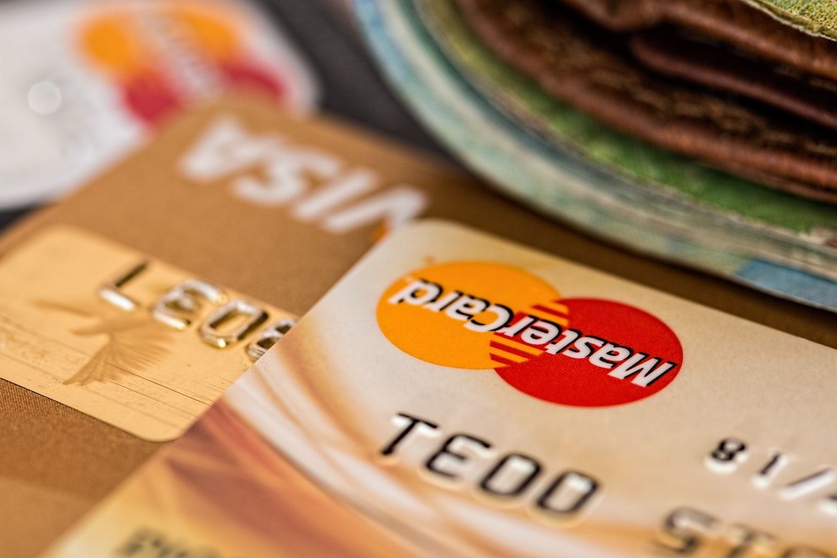 Close up of Mastercard credit card, with Visa credit card in foreground.