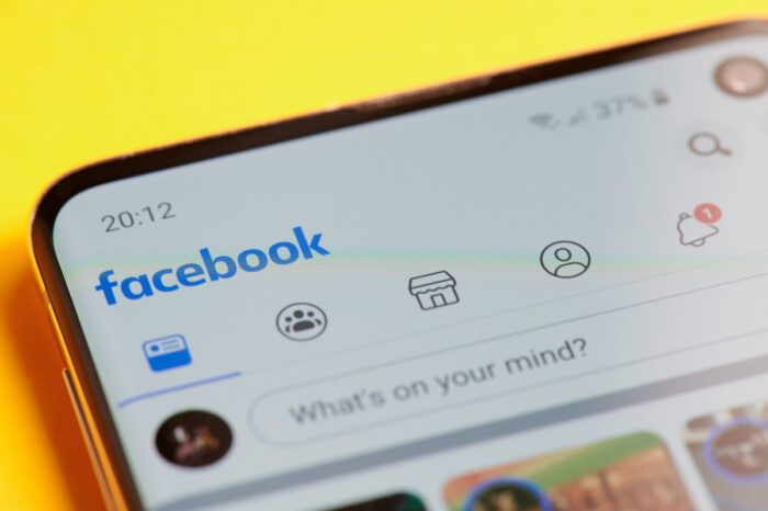 Menu of facebook app in smartphone screen close up view.