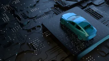 Close up of a mini vehicle on top of a motherboard.