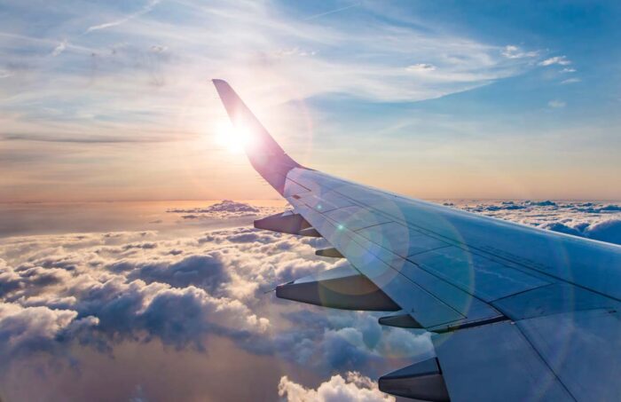 View from airplane window on the wing during sunset, representing the S-Trip class action lawsuit.