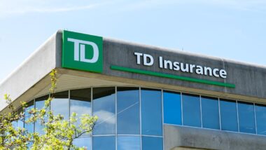 Close up of TD Insurance signage against a blue sky.