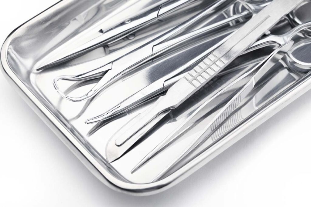 Close up of medical instruments in a steel tray, representing the Paramed settlement.