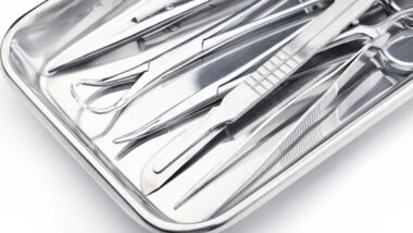 Close up of medical instruments in a steel tray, representing the Paramed settlement.