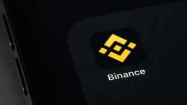 Close up of Binance app icon displayed on a smartphone screen, representing the Binance fine.