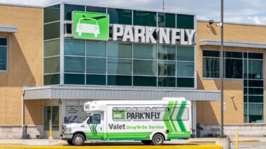 A shuttle bus in front of Park'N Fly building, representing the Park'N Fly data breach.