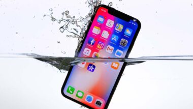 Close up of iPhone submerged in water, representing the Apple class action.