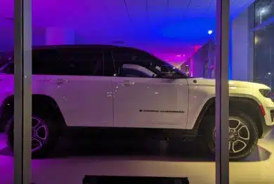 2023 Jeep Grand Cherokee illuminated display at a car dealership