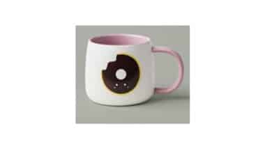 16oz white ceramic mug with a donut design on the front and back of the product.